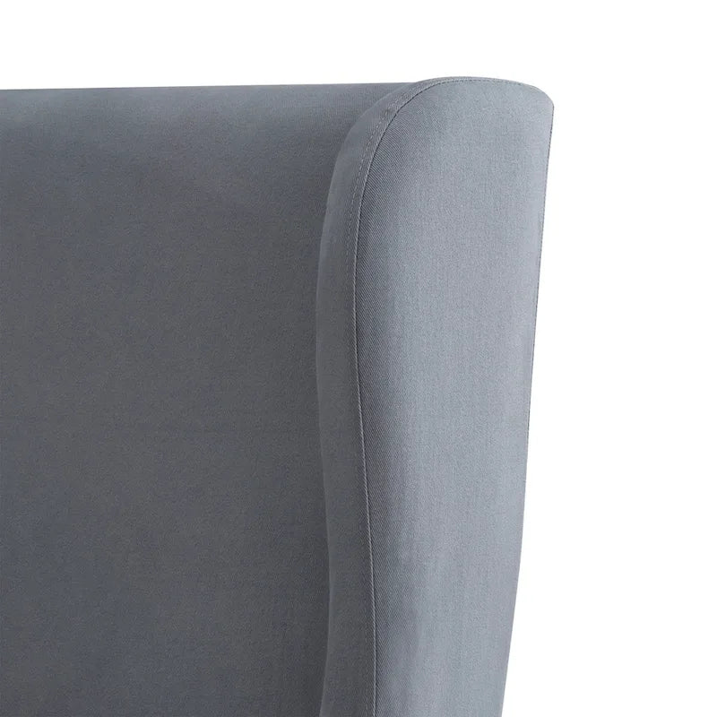 Fauteuil capitonné à oreilles