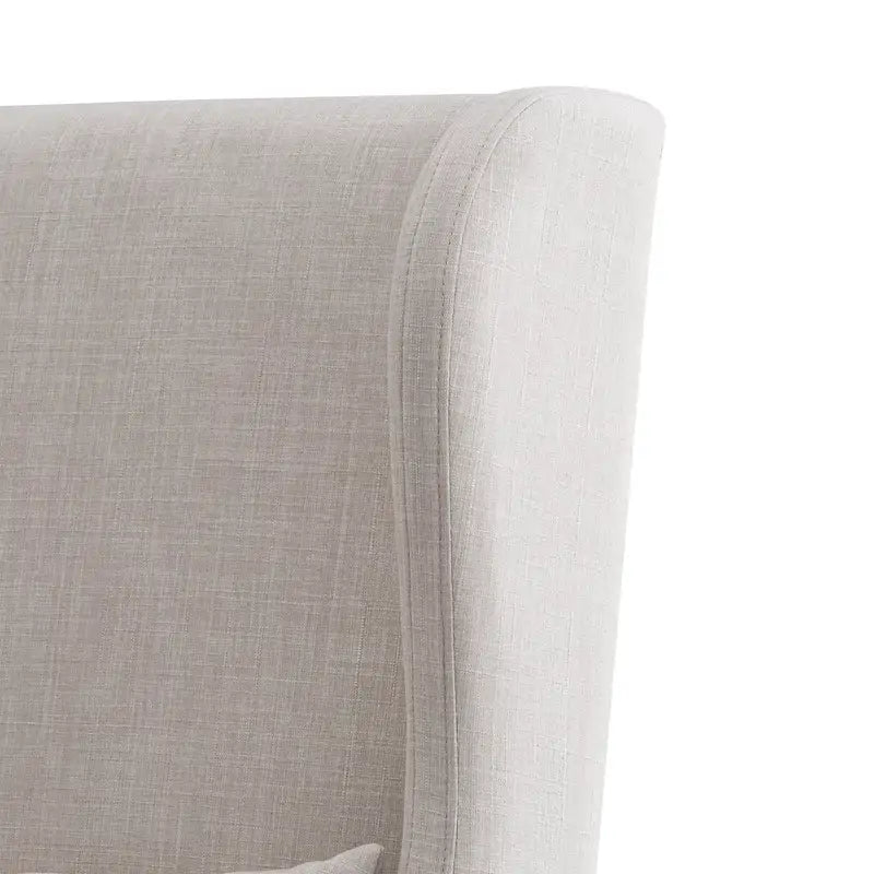Fauteuil capitonné à oreilles